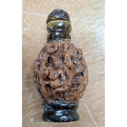 360 - Small intricately carved wooden Oriental snuff bottle