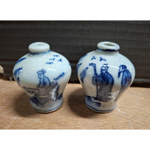 364 - Two tiny Oriental blue & white decorated snuff pots, both signed to base (2)