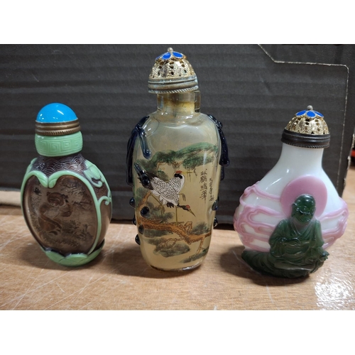 367 - Three decorated fine coloured glass Oriental snuff bottles (3)