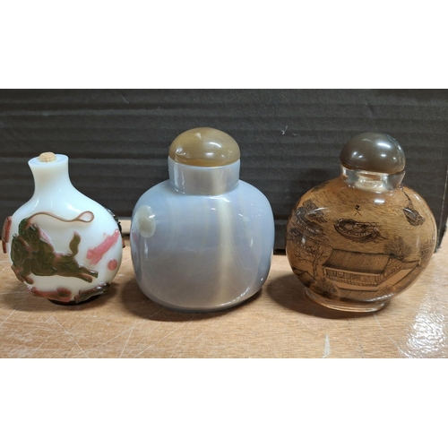 368 - Three decorated fine coloured Oriental snuff bottles (3)