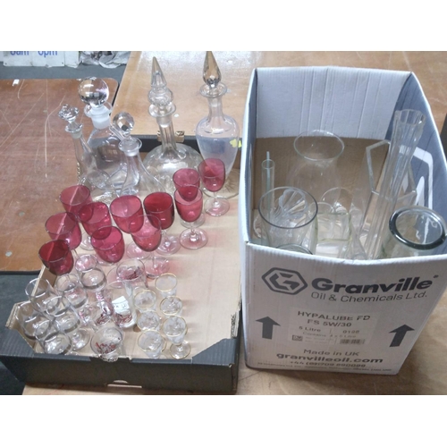 297 - Collection of glassware to include decanters, vases and cranberry glass