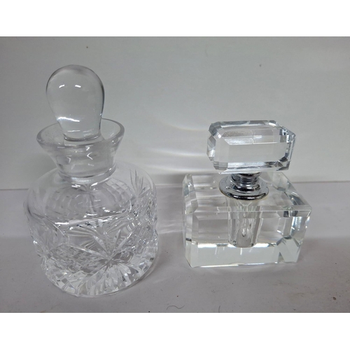 68 - Fine quality, Art Deco cut glass perfume bottle together with a smaller cut-glass example (2)