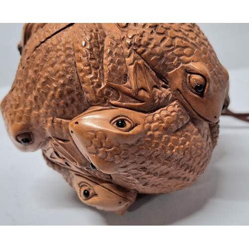 31 - Netsuke Frog ball with tiny glass eyes together with a carved toggle of a Frog on an Acorn