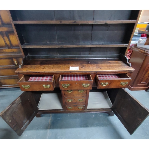 77 - Antique Oak dresser, possibly mid 1800's, with removable top section comprising of two doors and fou... 