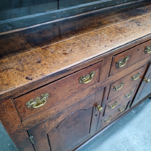 77 - Antique Oak dresser, possibly mid 1800's, with removable top section comprising of two doors and fou... 