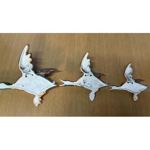 83 - Set of 3 Beswick graduating flying Ducks wall plaques with impressed marks 5692 etc to back (3)