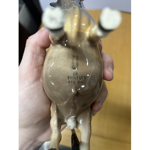 106 - BESWICK JERSEY BULL DUNSLEY COY BOY,

17cm long X 12cm tall