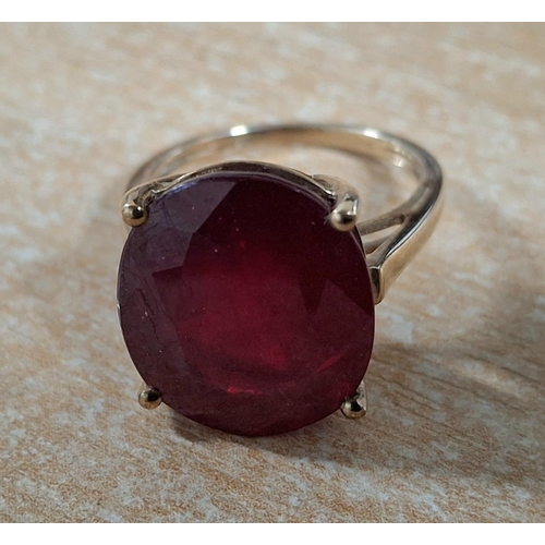 190 - 9ct yellow gold ring with large oval cut Ruby,

4.7 grams gross         Size J/K