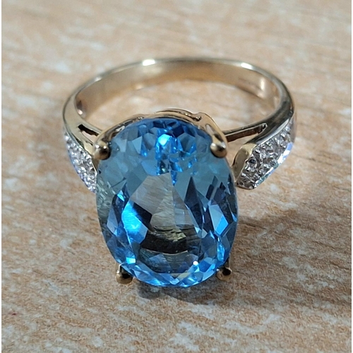 191 - Hallmarked 9ct yellow gold ring with a large round cut Topaz,

4.7 grams gross            Size J/K