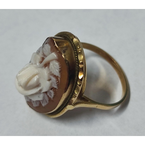 157 - Floral cameo ring, stamped 750, 5.4 grams gross, size - Q