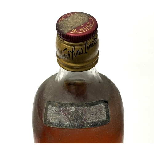 146 - An old bottling of Johnnie Walker Red label which, we estimate, dates from the late 1960s,

262/3 fl... 