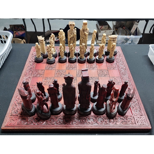 232 - Chess set depicting characters from an oriental dynasty period, repair to one rook