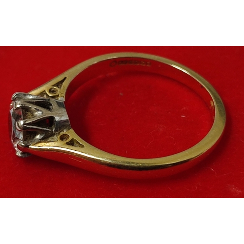 91 - A traditional 18ct. Gold and Diamond solitaire ring, claw set, Gold shank with round brilliant cut D... 