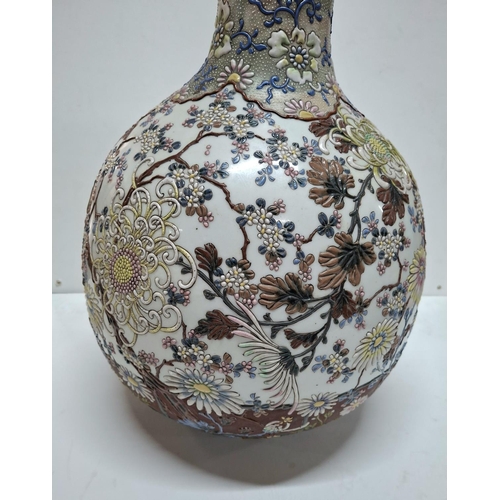 119 - Unique tall Japanese 18thC/19thC bottle necked vase with extensive polychrome applied floral decorat... 