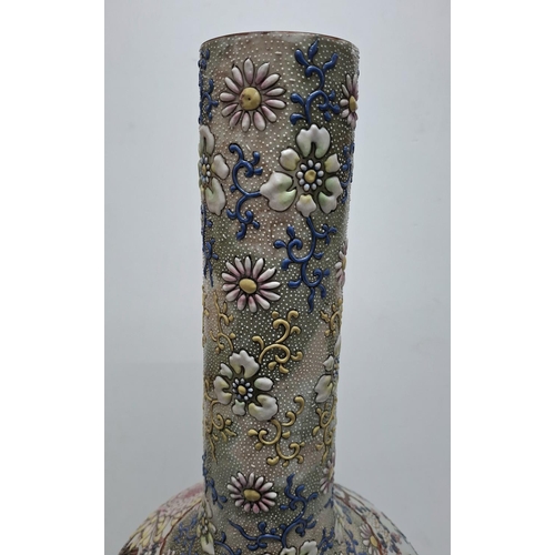 119 - Unique tall Japanese 18thC/19thC bottle necked vase with extensive polychrome applied floral decorat... 