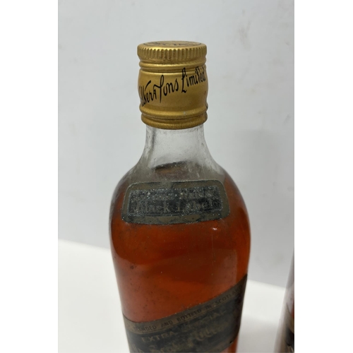 147 - Two slightly different 1960s/70s bottles of Johnnie Walker black label Scotch whiskey (2),

Both 26 ... 