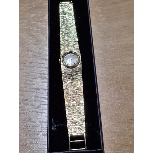 215 - Bulova  23 jewel ladies 9ct gold cocktail watch hallmarked 9ct gold bark effect strap

36.5g gross