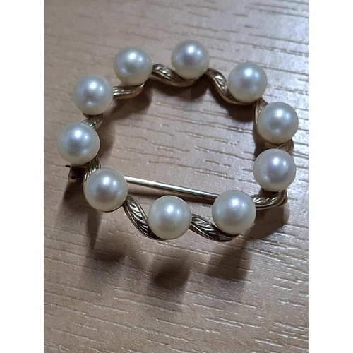 221 - 9ct Gold and pearl brooch with associated 9ct gold and pearl ring (2),

9.5 grams gross