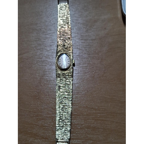 80 - Bulova  23 jewel ladies 9ct gold cocktail watch hallmarked 9ct gold bark effect strap

36.5g gross