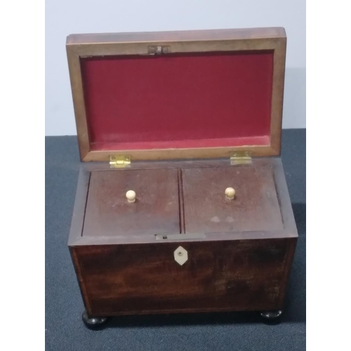 89 - A George III inlaid mahogany tea caddy