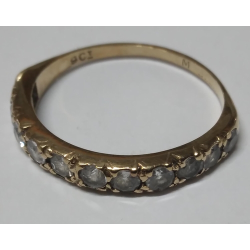 41 - 9ct stamped yellow gold & gem set half eternity ring,

1.5 grams                  Size N