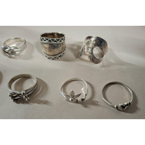 56 - Collection of 12 silver rings, the vast majority stamped 925 or silver etc (12),

67 grams