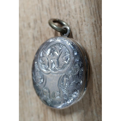 43 - Rare, trifold, duel-hinged silver locket with different scrolled engraving to either side