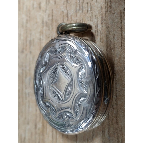 43 - Rare, trifold, duel-hinged silver locket with different scrolled engraving to either side