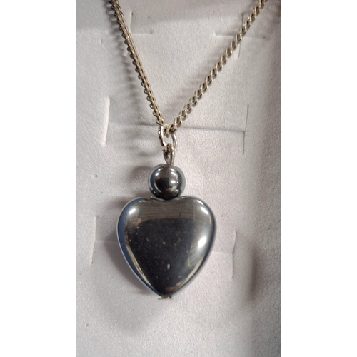 73 - Three 925 silver chains with a 2 glass bead pendant, a Rose Quartz heart pendant and a gray bead hea... 