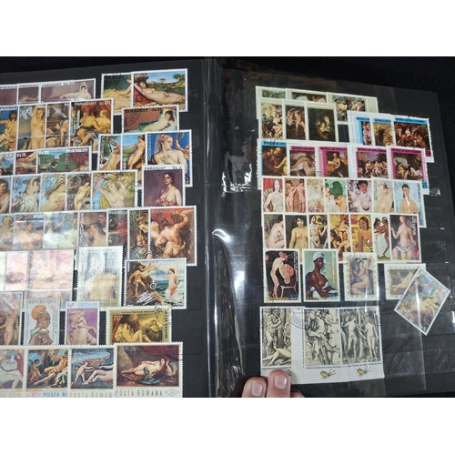 365 - Black stock book containing a large quantity of various female nude stamps, Ajman stamps and many mi... 