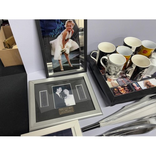 348 - Collection of Marilyn Munroe items including cups, tray, mirros and pictures