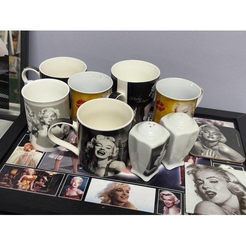 348 - Collection of Marilyn Munroe items including cups, tray, mirros and pictures