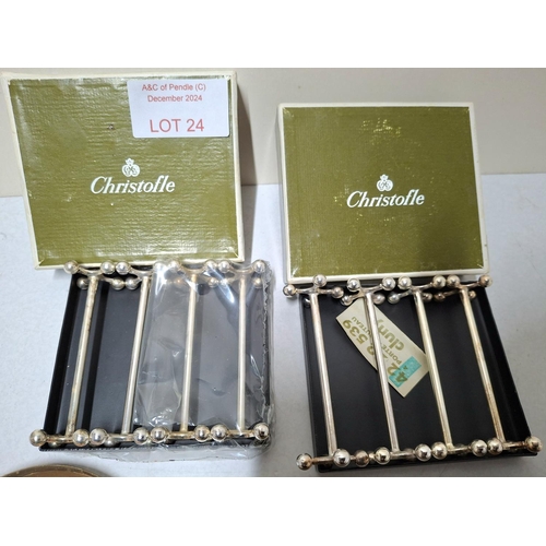 24 - Two boxed sets of 4 plated knife and fork rests by Christofle of France together with a set of 6 col... 