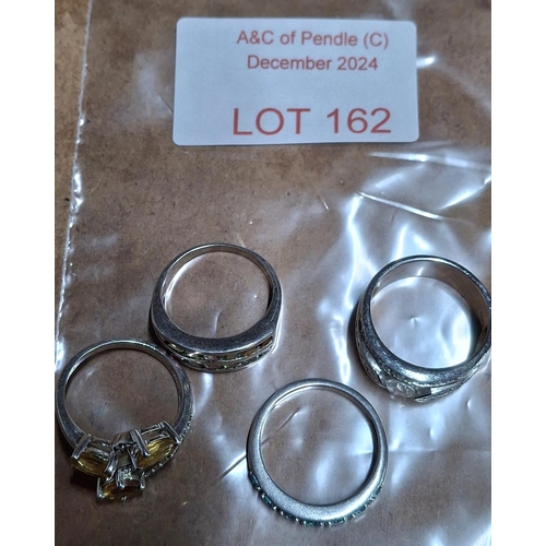 162 - Four silver rings inset with stones, approx 20 grams (4)