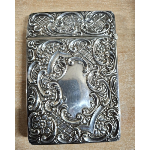 18 - Stunning 1905 Birmingham silver card case with extensive decoration to both sides,

approx 61 grams