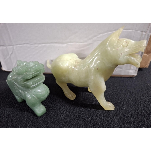 94 - Two separate carved Jade Foo dogs