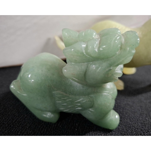 94 - Two separate carved Jade Foo dogs