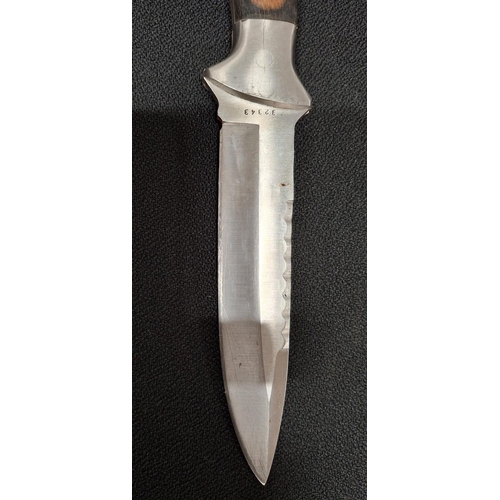 97 - British 20thC stainless steel 440 bladed serrated edged hunting knife with original leather sheath w... 