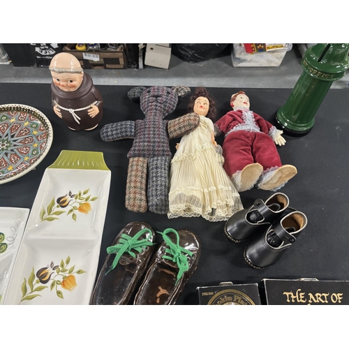 135 - Collection of items including Dolls, Pair of Clogs and Dutch Plate