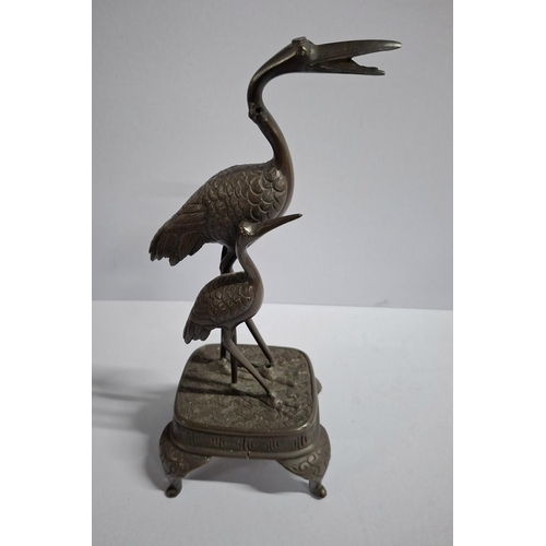 144 - Japanese cast bronze depicting two Herons,

approx 25cm tall         approx 700 grams