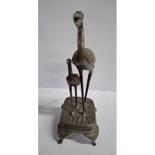 144 - Japanese cast bronze depicting two Herons,

approx 25cm tall         approx 700 grams