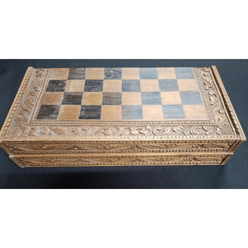 190 - Fine quality chess board with hand-carved Oriental wooden figures with fold-up carry board, also car... 