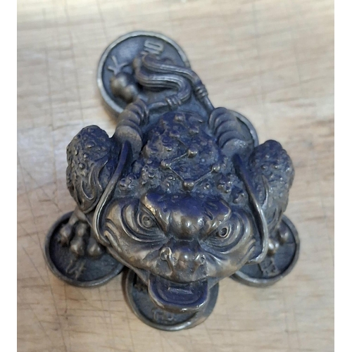 209 - Solid oriental bronze of a Toad sat on coins,

390 grams