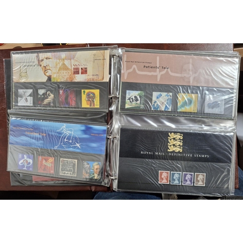 260 - Brown Royal Mail album containing approx 40 1999-2000 GB stamp packs (approx 40)