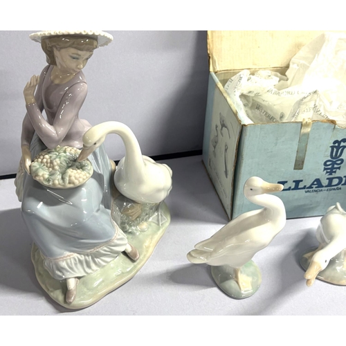 390 - 3 Lladro swans with a girl and swan Lladro figure