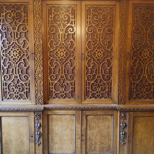 441 - A stunning antique Oak gothic-esque cabinet, hand-carved frontal fretwork comprising of four doors a... 