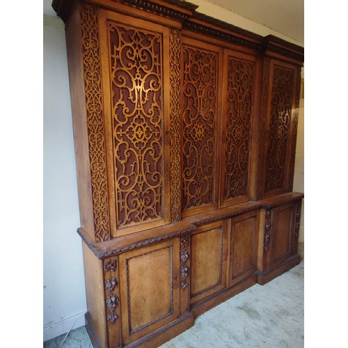 441 - A stunning antique Oak gothic-esque cabinet, hand-carved frontal fretwork comprising of four doors a... 