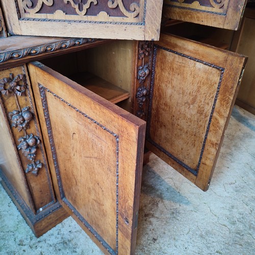 441 - A stunning antique Oak gothic-esque cabinet, hand-carved frontal fretwork comprising of four doors a... 