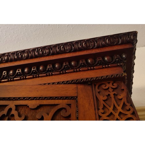 441 - A stunning antique Oak gothic-esque cabinet, hand-carved frontal fretwork comprising of four doors a... 