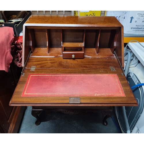 474 - A mid-century bureau with drop-front revealing a red leather top with gilt border and inner compartm... 